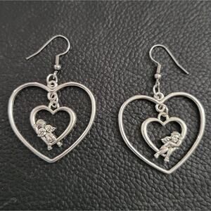 Cupid 2 sided sitting on a heart valentine's day earrings